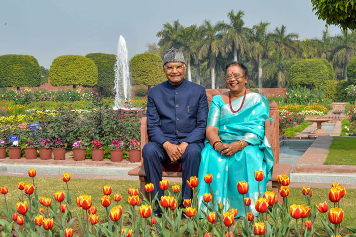 President Ram Nath Kovind with his wife Savita poses for photographs during the opening of annual Udyanotsav (Festival of Gardens), at Mughal Garden of Rashtrapati Bhawan in New Delhi, on Tuesday