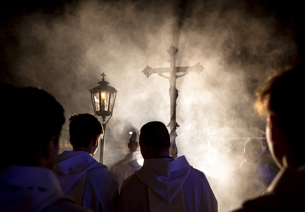 Priests and clergy walk in a procession to attend the Christmas celebration midnight Mass at the Cathedral-Basilical in Vilnius, Lithuania, Tuesday, Dec. 24, 2019. Over 80 percent of Lithuanians are Christians who celebrate the festival of Christma.