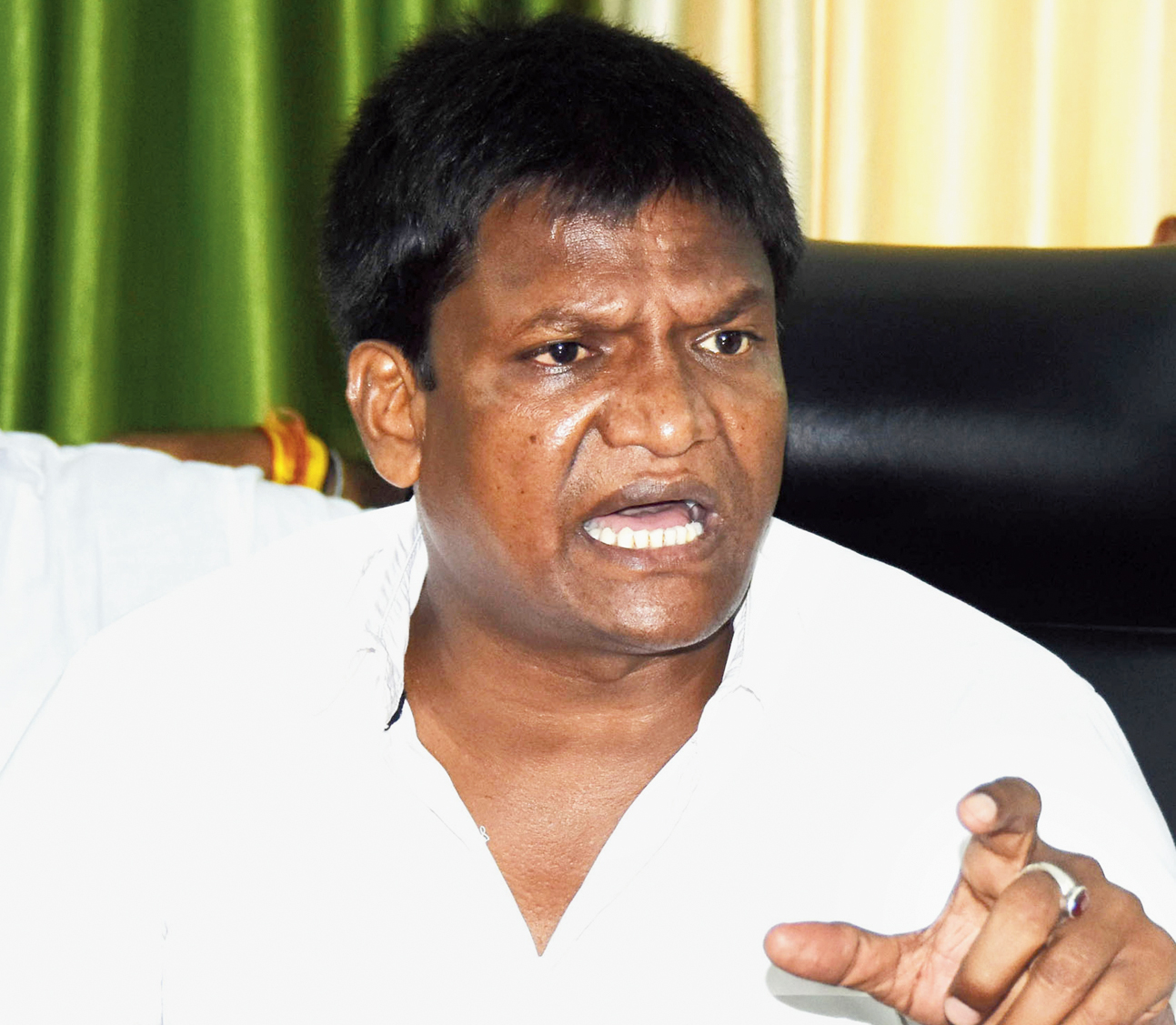 Dhullu Mahto: backs workers but denies charges
