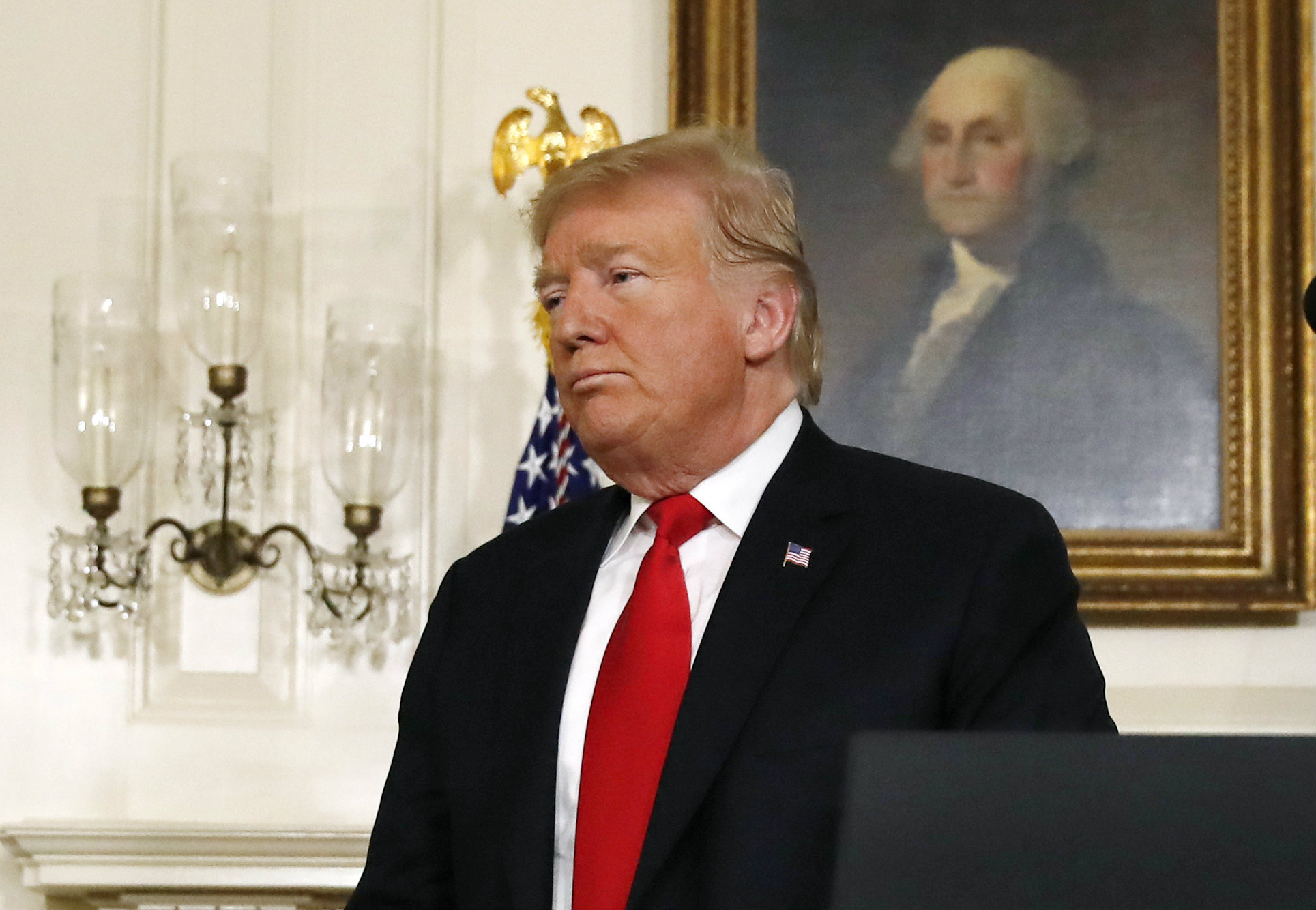 Donald Trump leaves the podium after speaking about the partial government shutdown, immigration and border security in the Diplomatic Reception Room of the White House, in Washington, on Saturday.