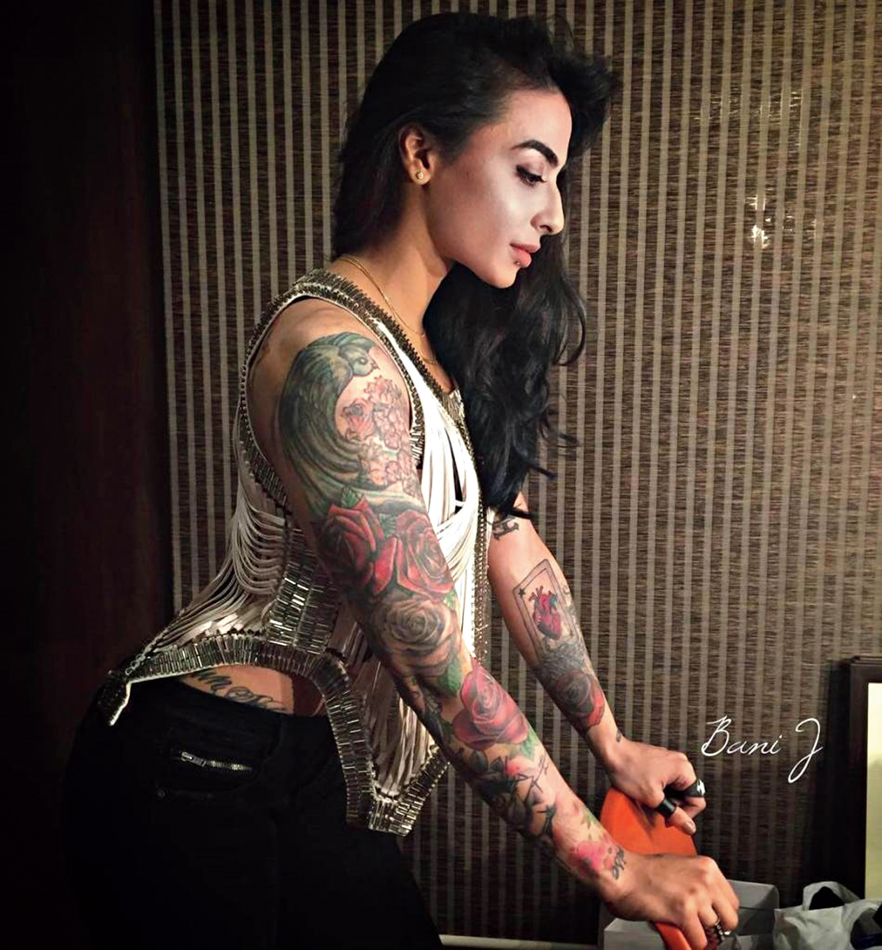 Bani J just posted a topless photo on Instagram and it draws attention to  her stunning tattoos