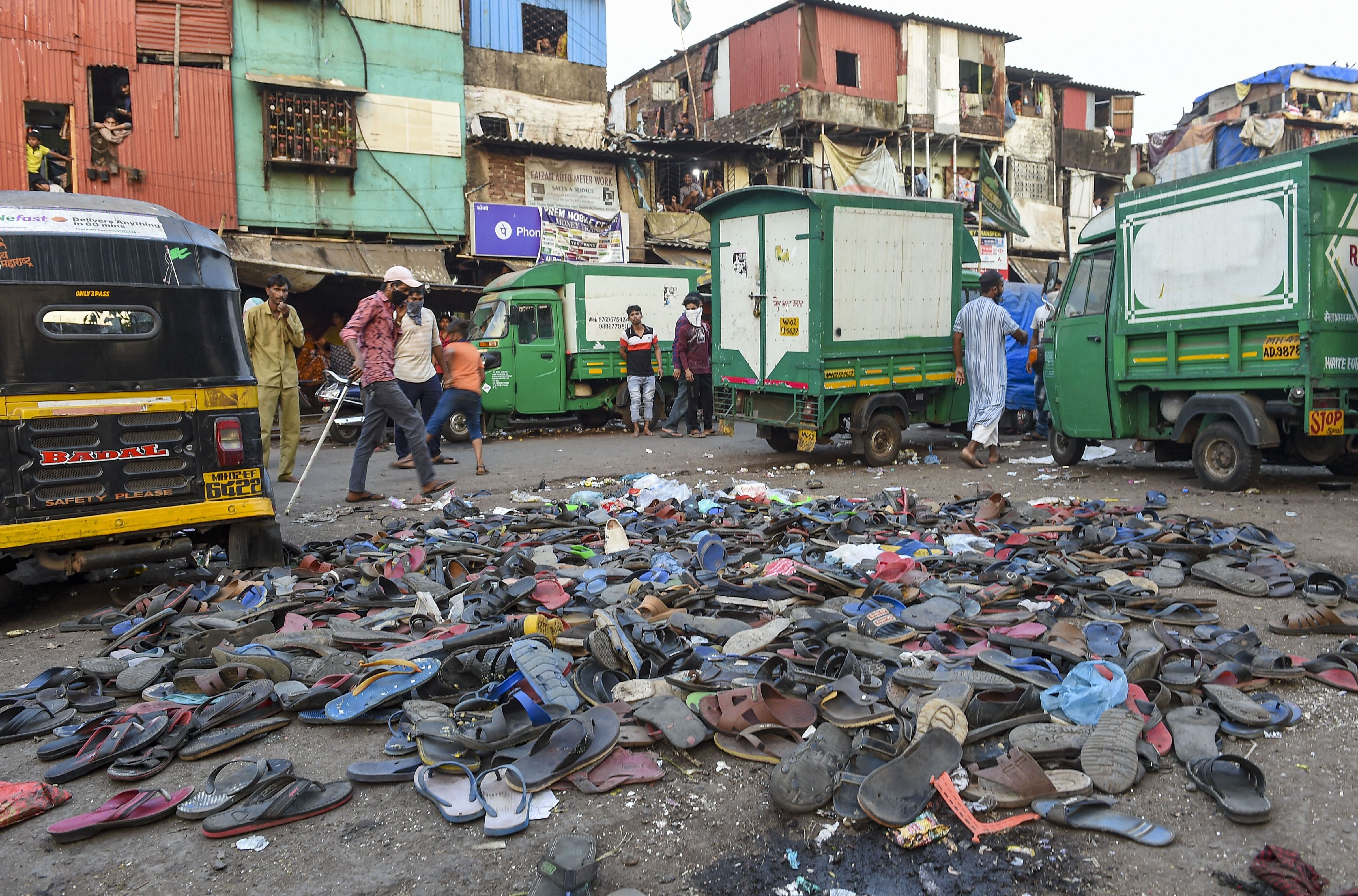 Footwear of protestors is seen lying on the road after after police action on migrant workers who defied lockdown norms and wanted to leave for their native places, after the extension of lockdown till May 3 in the wake of coronavirus pandemic, outside Bandra Railway Station in Mumbai, Tuesday, April 14, 2020.