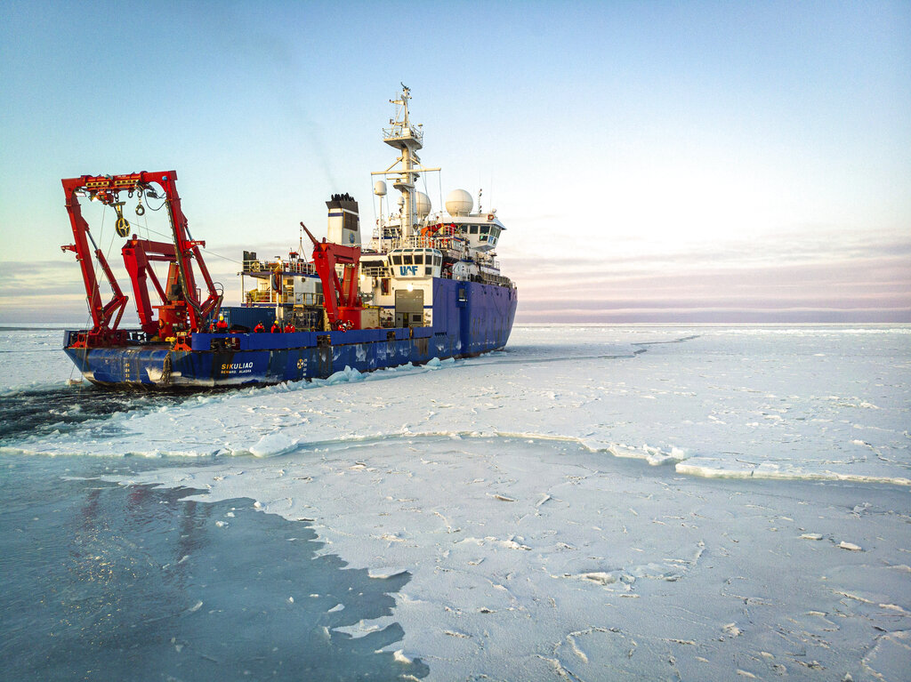 In this Nov. 14, 2019 photo provided by John Guillote and taken from an aerial drone shows the research vessel Sikuliaq as it makes its way through thin sea ice in the Beaufort Sea off Alaska's north coast.