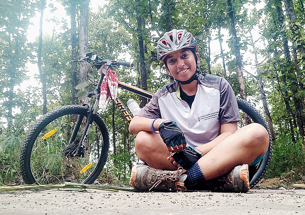 The cyclist takes a break during her expedition