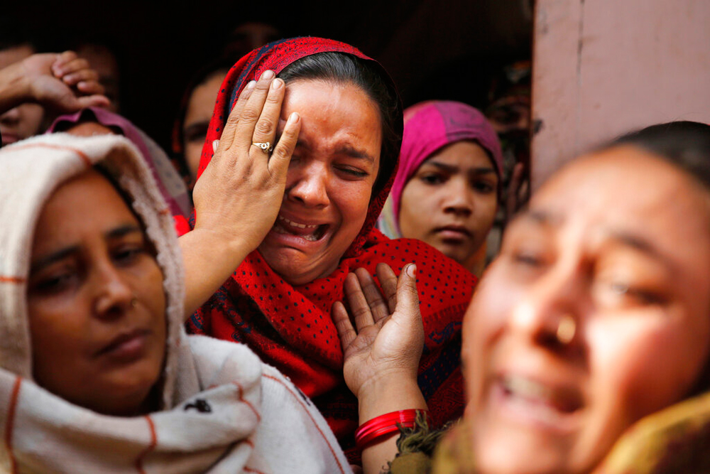 The sister of Mohsin Ahmad, a labourer who was shot and killed allegedly in police firing, outside her home in Meerut