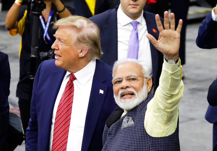 In this September 22, 2019, file photo, Prime Minister Narendra Modi and US President Donald Trump walk around NRG Stadium waving to the crowd during the 'Howdy Modi: Shared Dreams, Bright Futures' event in Houston.