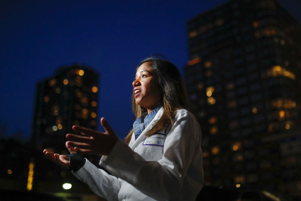 Kamini Doobay, an Emergency Medicine Resident physician at NYU Langone Medical Center and Bellevue Hospital, talks during an interview about her experiences treating COVID-19 patients, Thursday, March 26, 2020, in New York. As an emergency medicine physician in New York City, Dr. Doobay has always known that death is part of the territory in trying to care for the city's sickest. But it hasn't been like this _ patients stricken with coronavirus, on ventilators, and no visitors allowed because of strict protocols to prevent its spread.