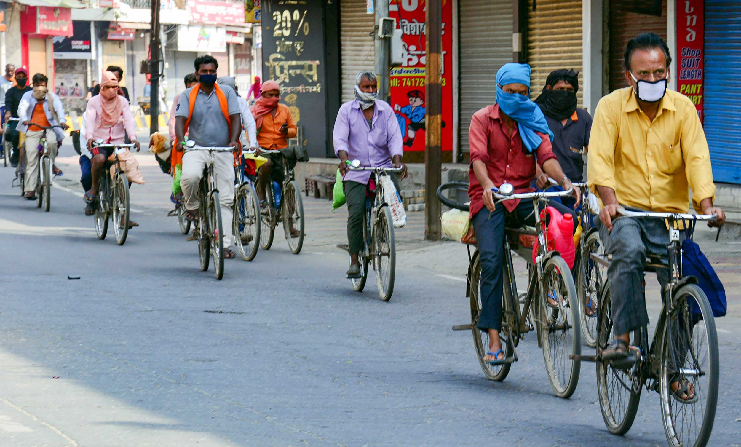 Migrant workers cycling to their native towns, pass through Muzaffarnagar, on Thursday.
