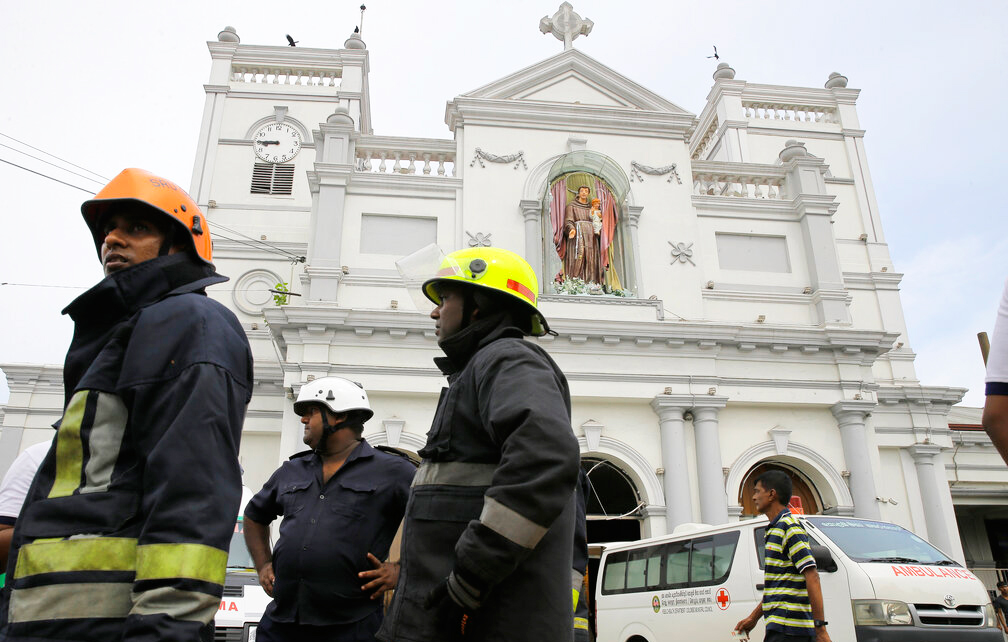 Sri Lankan firefighters stand in the area around St. Anthony's Shrine after a blast in Colombo, Sri Lanka, Sunday, April 21, 2019.