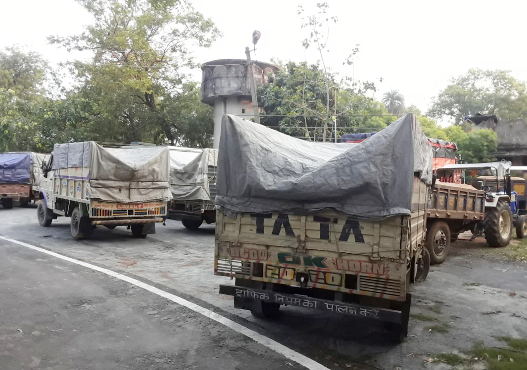 Seized trucks and tractors loaded with sand are parked at Tundi police station in Dhanbad after Thursday’s raid