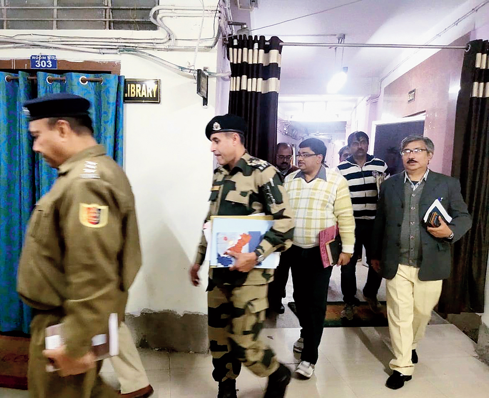 BSF and police officers arrive for the meeting in Malda on Wednesday