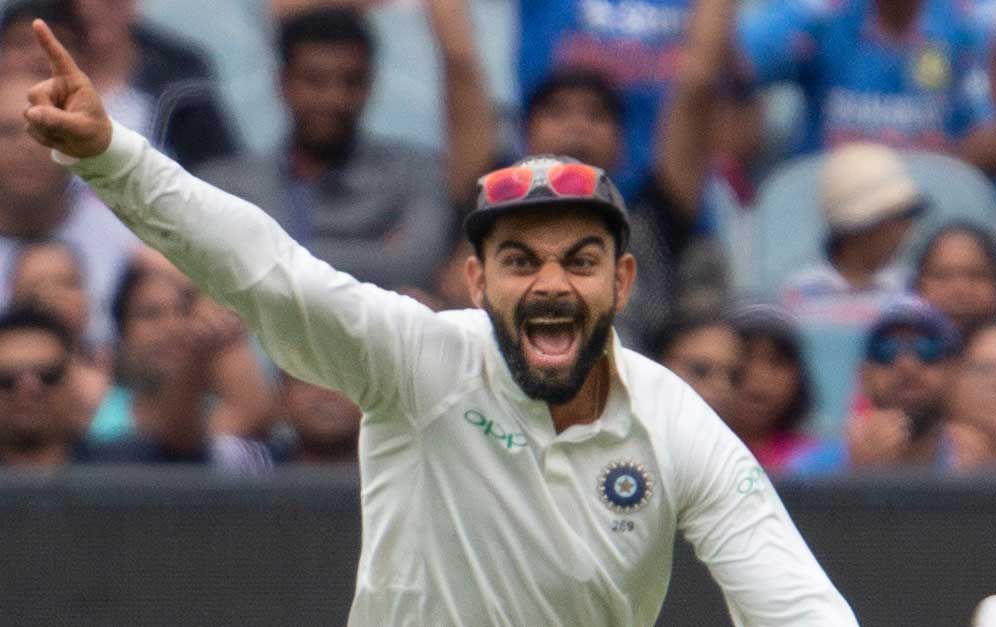 Virat Kohli celebrates the fall of an Australian wicket on the fourth day of the final Test at the SCG on Sunday. (Getty Images)