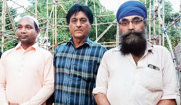 (From left) Abusalam, Swapan and Balbir at their puja site in Andal near Durgapur.