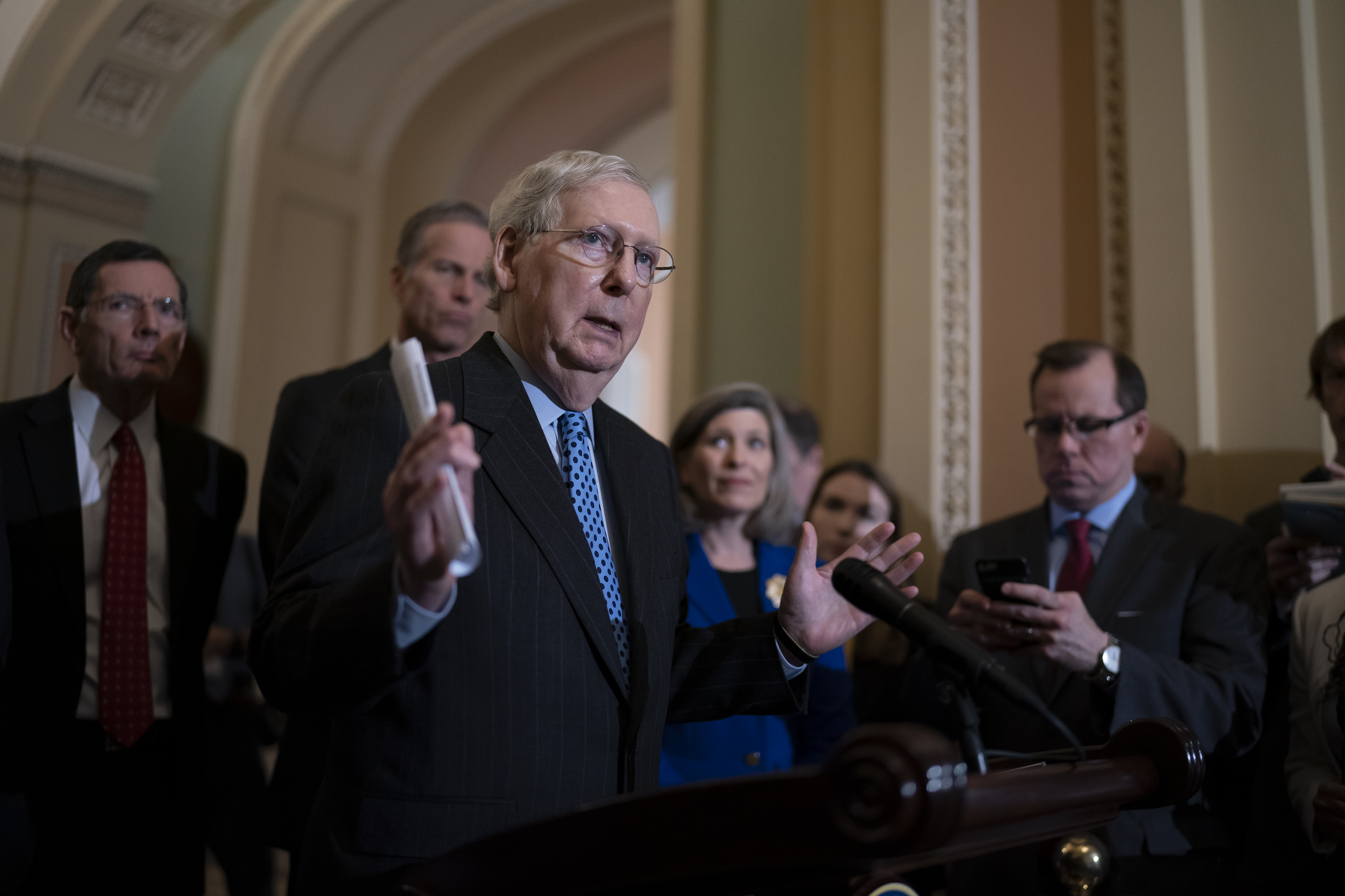 Senate Majority Leader Mitch McConnell, R-Ky., joined by, from left, Sen. John Barrasso, R-Wyo., Majority Whip John Thune, R-S.D., and Sen. Joni Ernst, R-Iowa, talks to reporters following a GOP strategy meeting at the Capitol in Washington on Tuesday