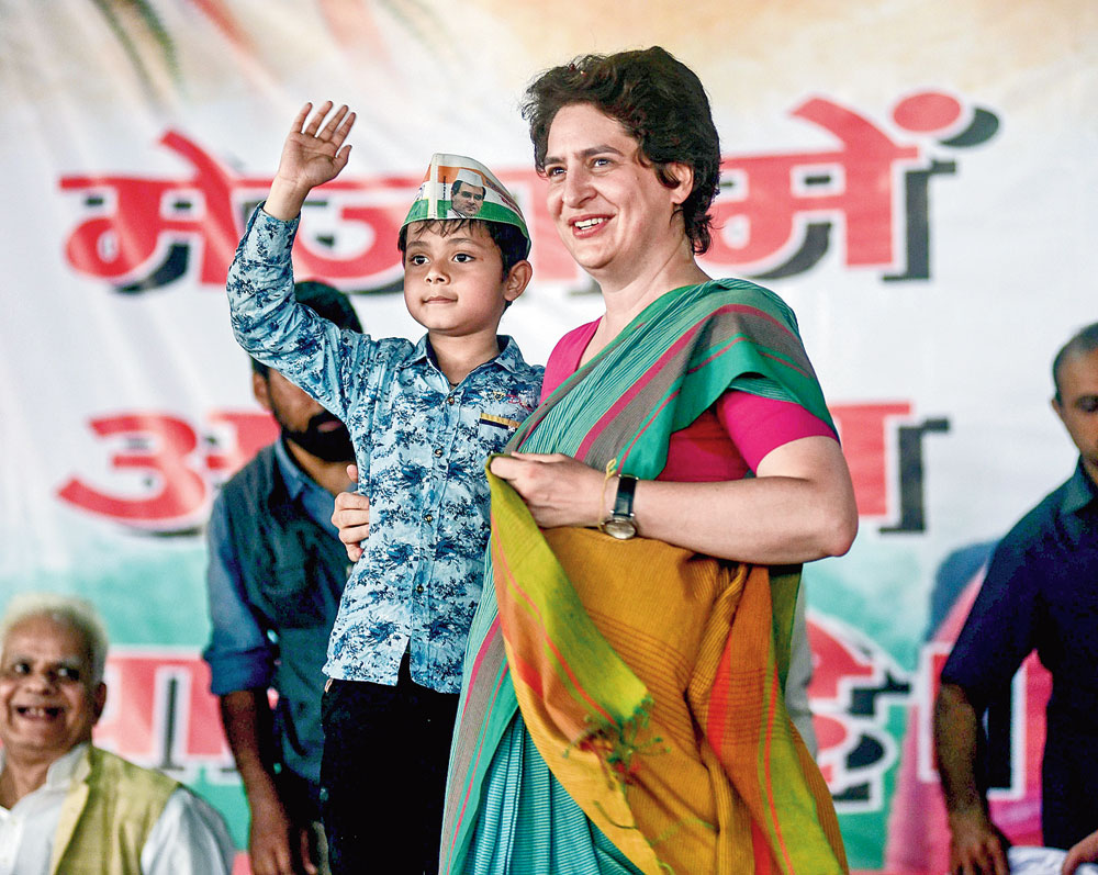 Priyanka with a child at Sirsa village in Allahabad.