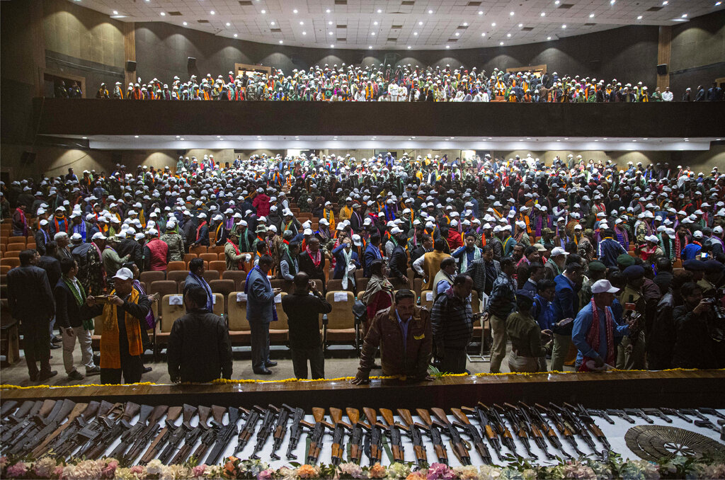 Cadres of National Democratic Front of Bodoland (NDFB) arrive for an arms laying ceremony in Gauhati