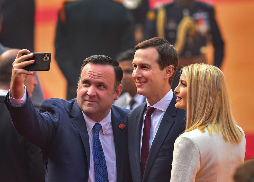 US White House Senior Adviser Jared Kushner (C) and his wife Ivanka Trump (R) pose for a selfie as they arrive for the ceremonial reception of US President Donald Trump at Rashtrapati Bhavan, in New Delhi