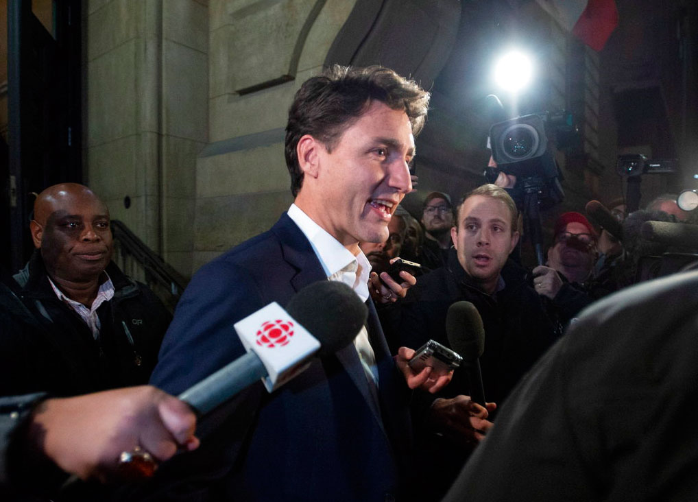 Prime Minister Justin Trudeau leaves the Office of the Prime Minister and Privy Council after an agreement was reached in the NAFTA negotiations in Ottawa, Ontario on Sunday.