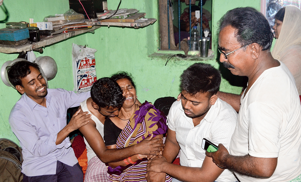 Bereaved family members of deceased Md Ishrar Khan at their house in Jharia, Dhanbad on Friday.