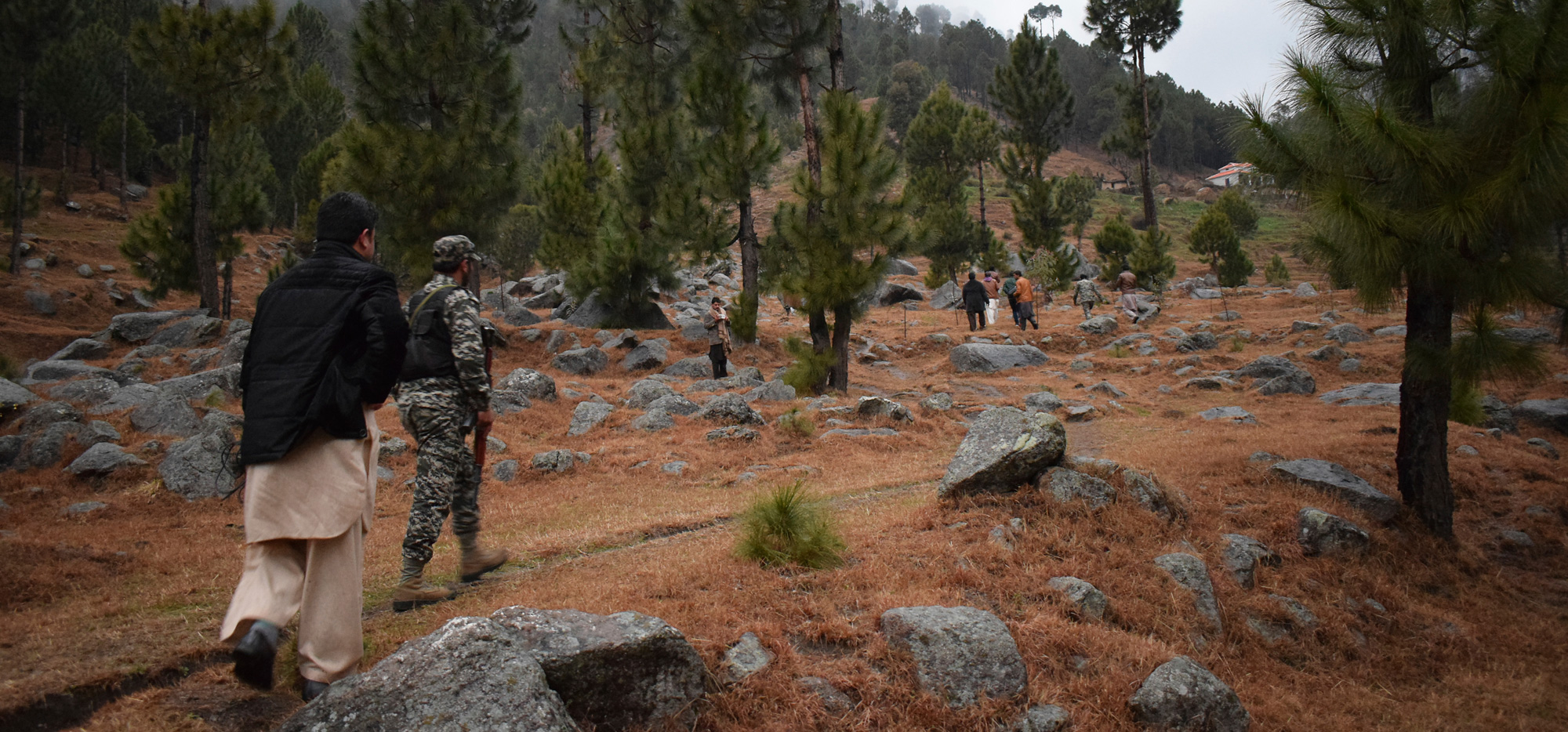 Pakistani reporters and troops visit the site of an Indian airstrike in Jaba, near Balakot, in Pakistan on Tuesday, February 26.
