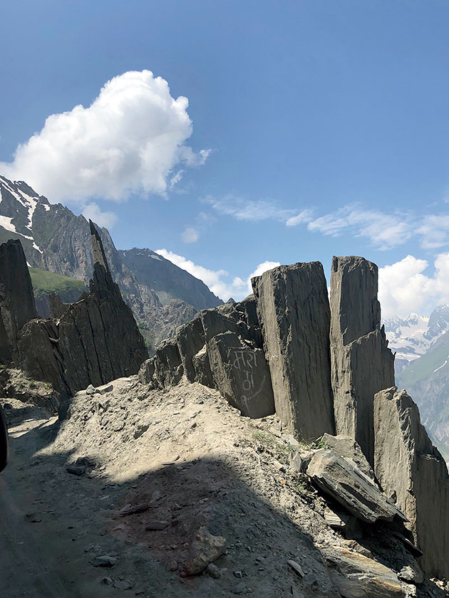 The approach to Kargil from the Kashmir Valley winds up the steep and often precarious Zoji La, a high pass 36 kilometres long; shut through winters and excessive snow, the road is mostly rutted and in need of constant repair during summer months.