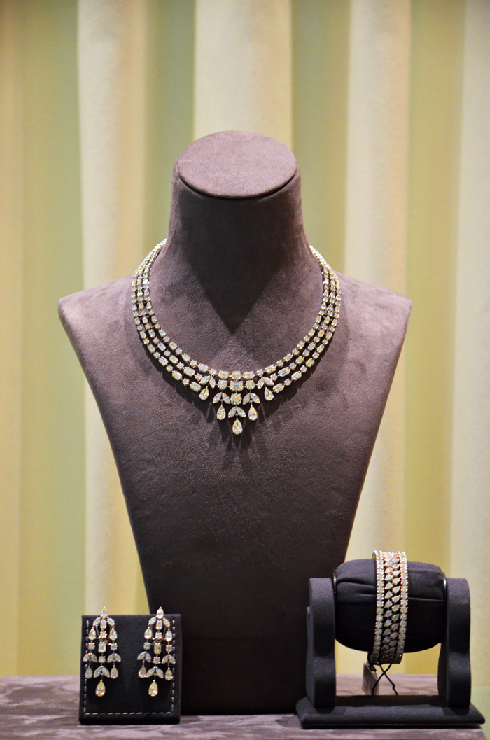 Accessorise your gown with this 18-carat gold necklace set studded with diamonds, at the engagement party. Paired with the earrings and bangles, this is a sure head-turner. 
Rs 1,25,00,000 @Nemichand Bamalwa and Sons (J)