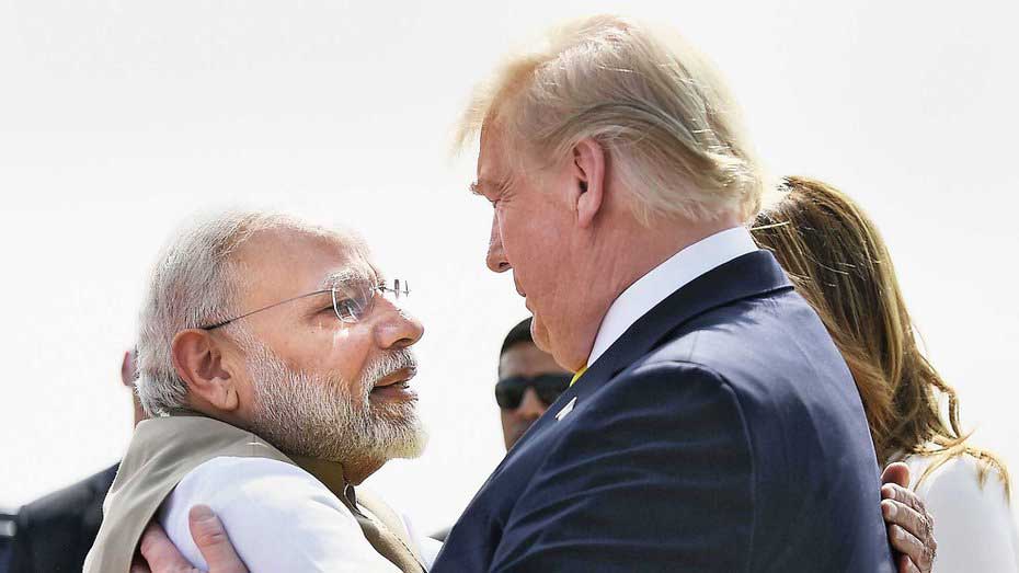 Prime Minister Narendra Modi hugs Donald Trump during the US President's visit to India in February. 