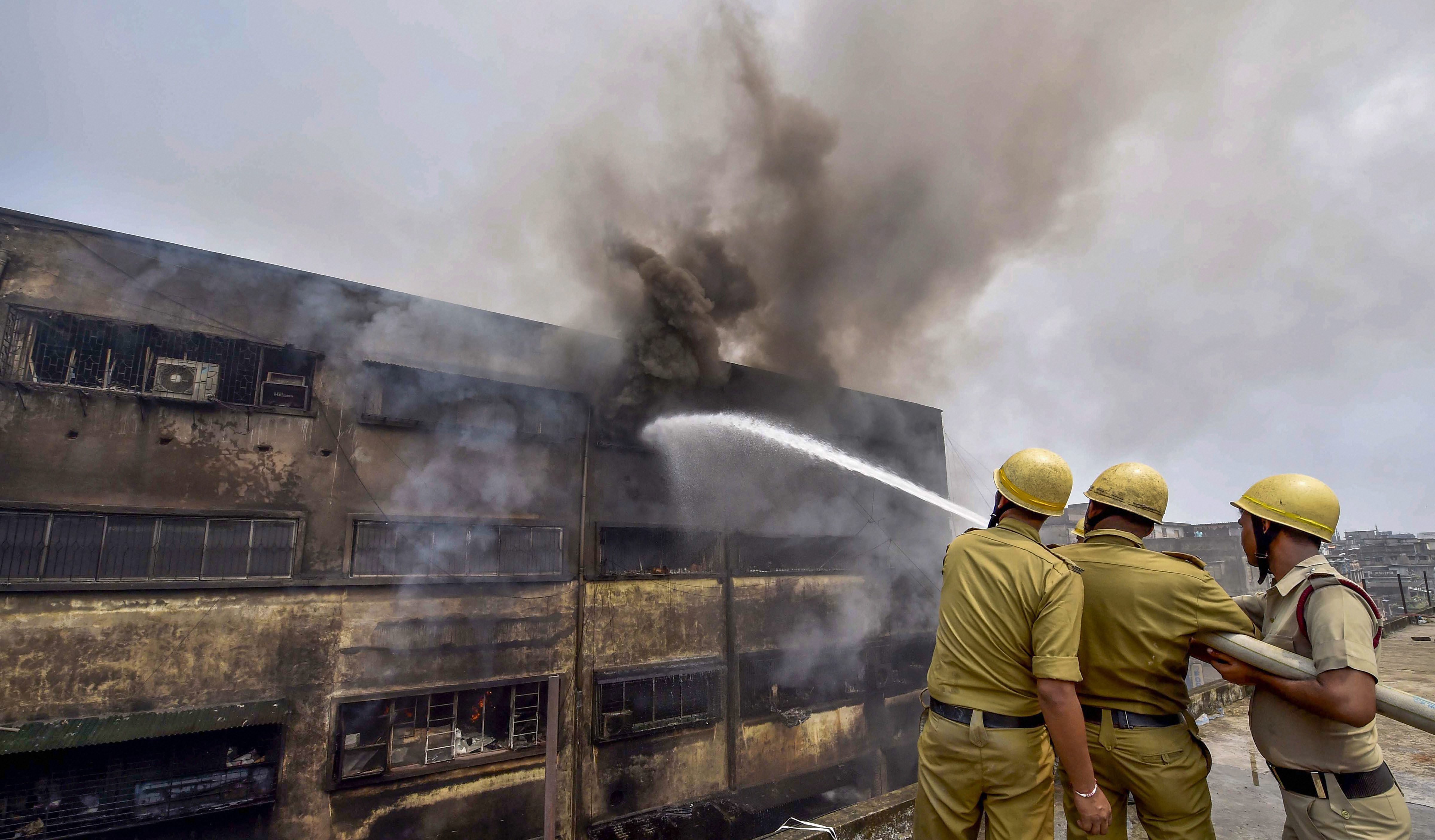Fire fighters battle flames for the second day after a fire broke out in Calcutta's Bagree Market on Sunday, September 16.