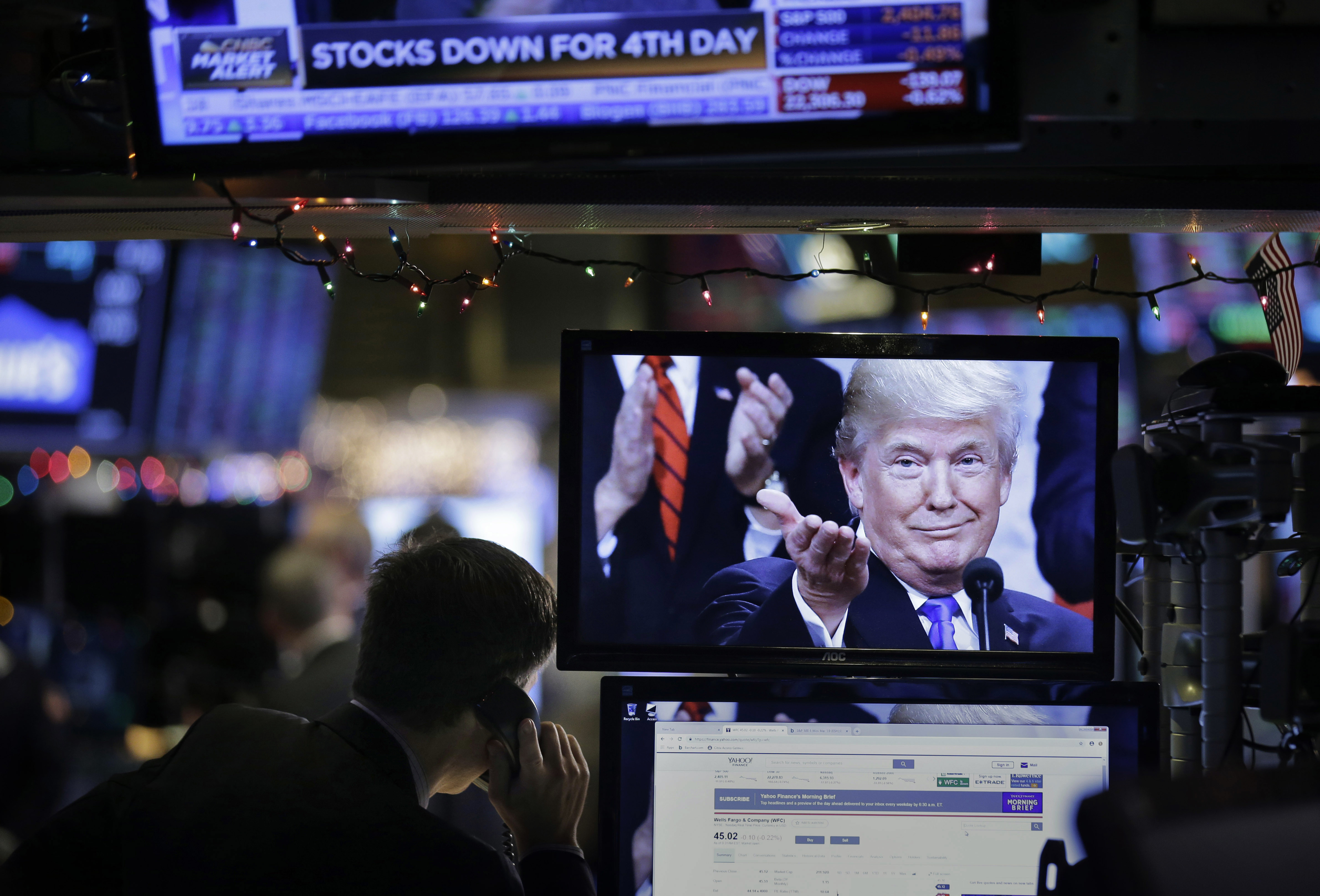 A picture of Donald Trump is displayed on a computer on the floor of the New York Stock Exchange on Monday.