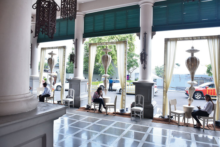 The foyer had wooden frames draped in cream curtains, with hanging installations. A seating arrangement with white chairs allowed shoppers to rest their tired feet.