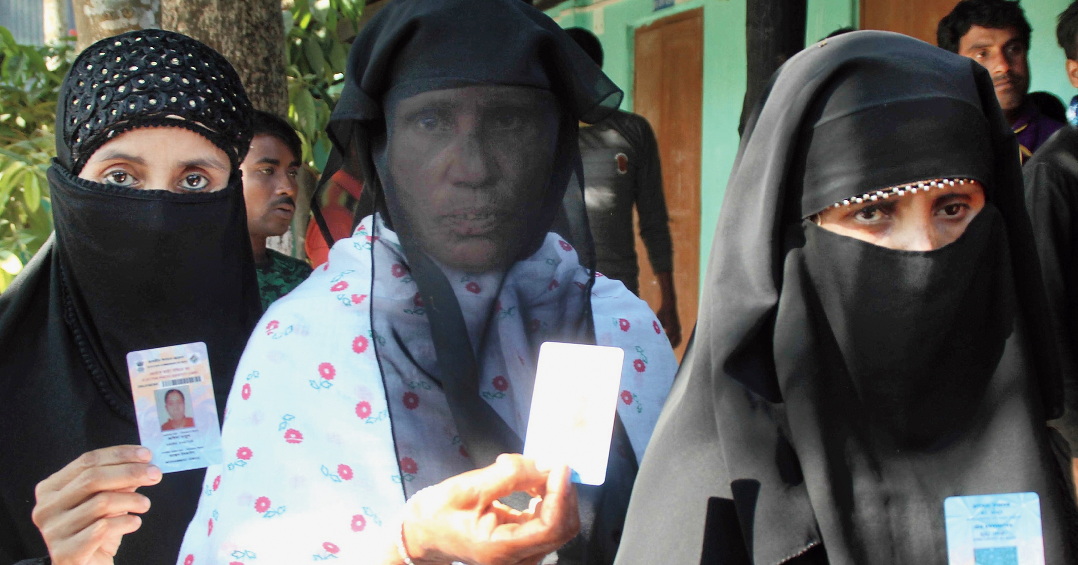 Women voters outside a booth in Dhubri on Sunday.