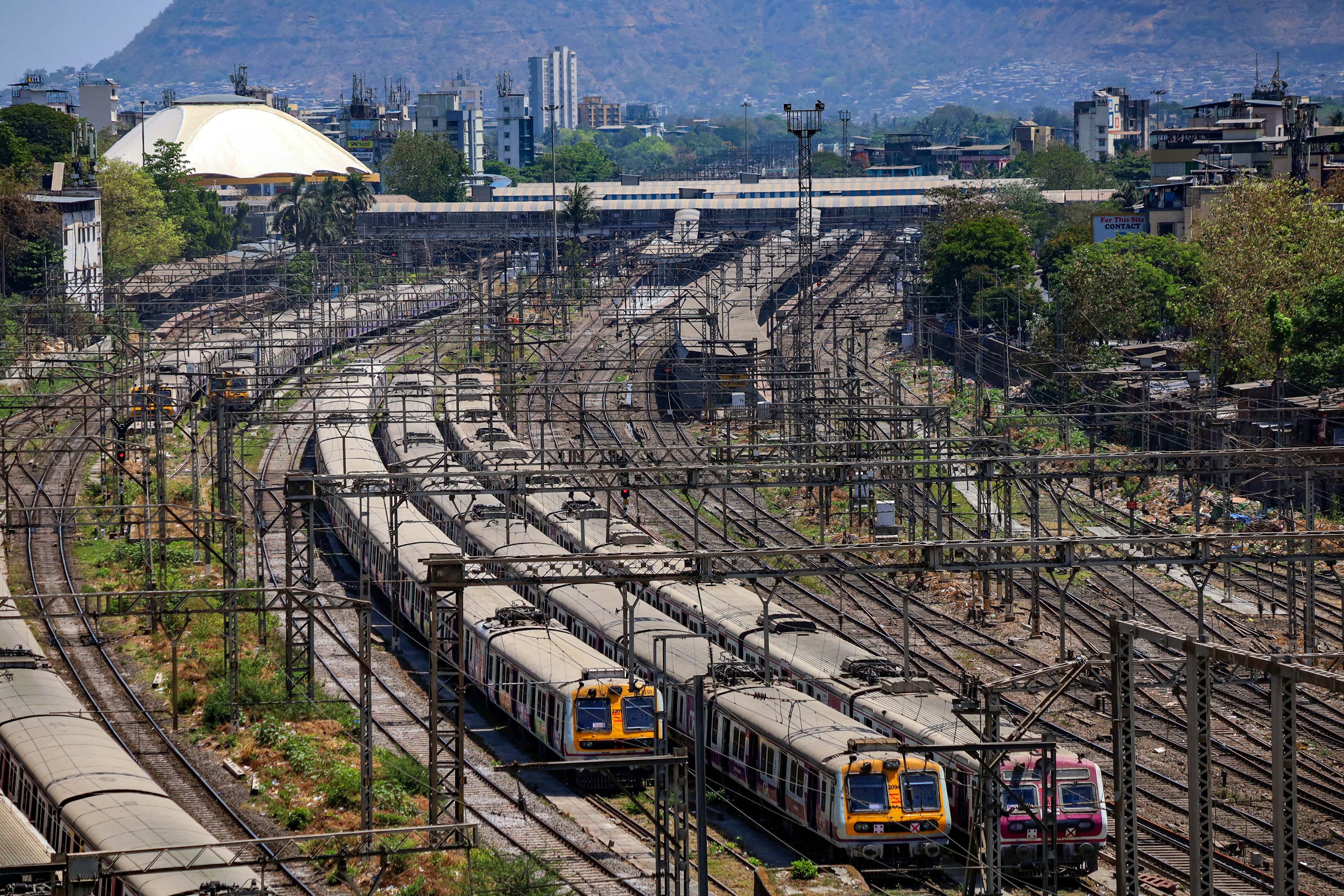 Trains are seen parked at a yard after lockdown in the wake of coronvirus pandemic, in Mumbai, Monday, March 23, 2020.