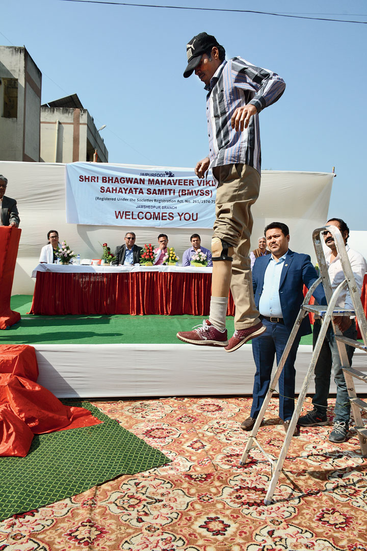 A person with an artificial limb jumps at the inauguration of the Jaipur Foot centre in Jamshedpur on Saturday. 