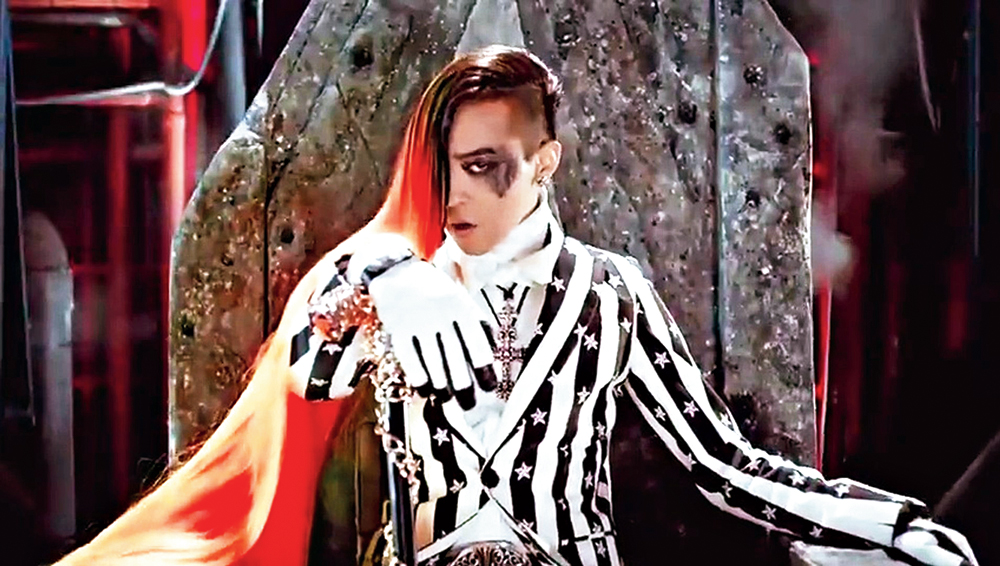 Before Ariana Grande sported a monstrous ponytail for 7 Rings, Big Bang’s G-Dragon — aka the King of K-pop — was seen wearing a 12-foot long shock of side-shaved hair, heavily-kohled eyes and a pinstriped suit for the cyberpunk-influenced music video of ‘Fantastic Baby’