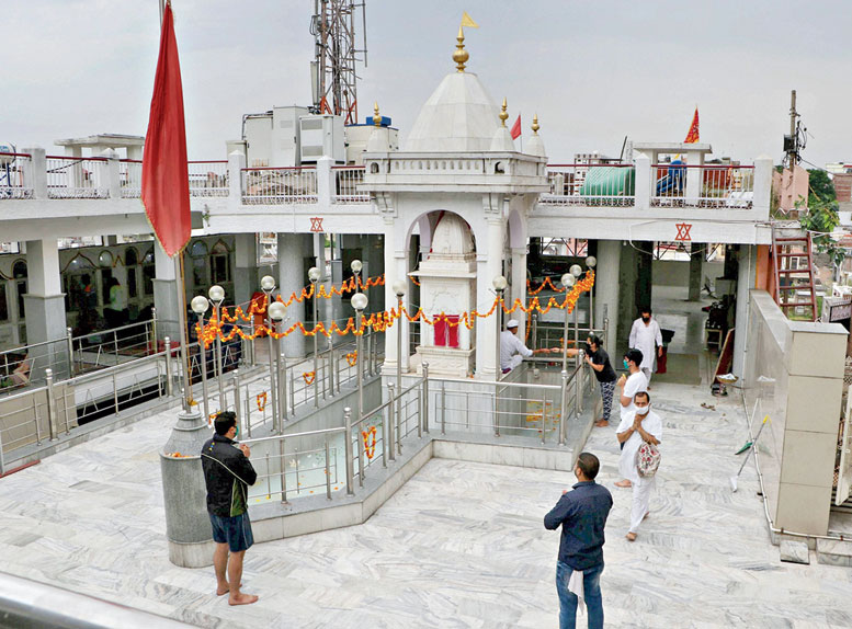 Kashmiri Pandits offer prayers at a replica of Kheer Bhawani temple on the occasion of the Mela Kheer Bhawani Mela in Jammu on Saturday. 
