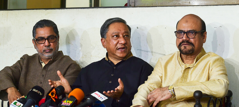 President of Bangladesh Cricket Board Nazmul Hassan Papon, centre, speaks during a press conference on the status of the country's cricket team after Friday's mass shootings in New Zealand, in Dhaka, Bangladesh on Friday, March 15, 2019.