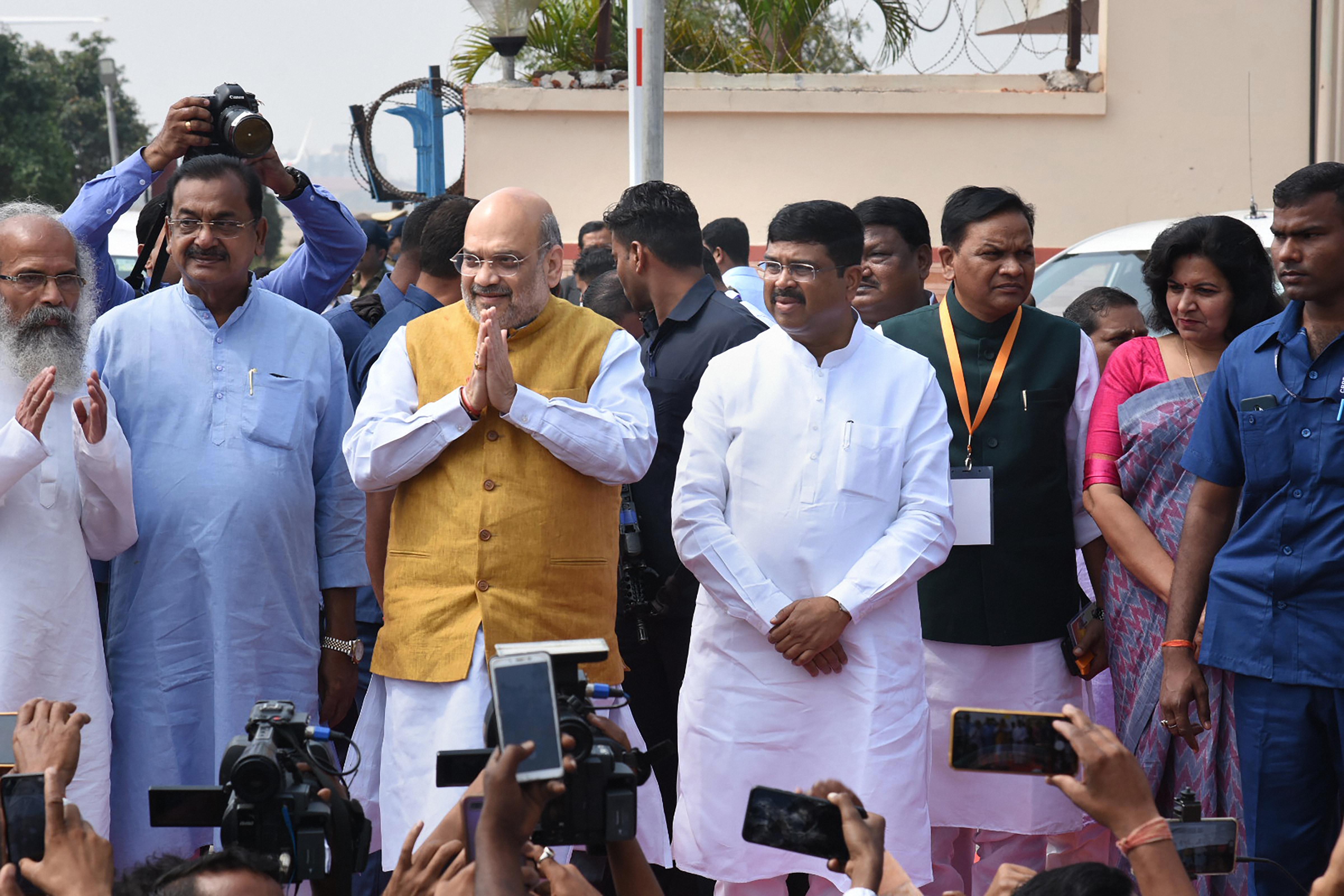 Union home minister Amit Shah is greeted by party workers at airport ahead of his of meeting of the Eastern Zonal Council (EZC) followed by a rally in support of the amended citizenship law, in Bhubaneswar, Friday, February 28, 2020