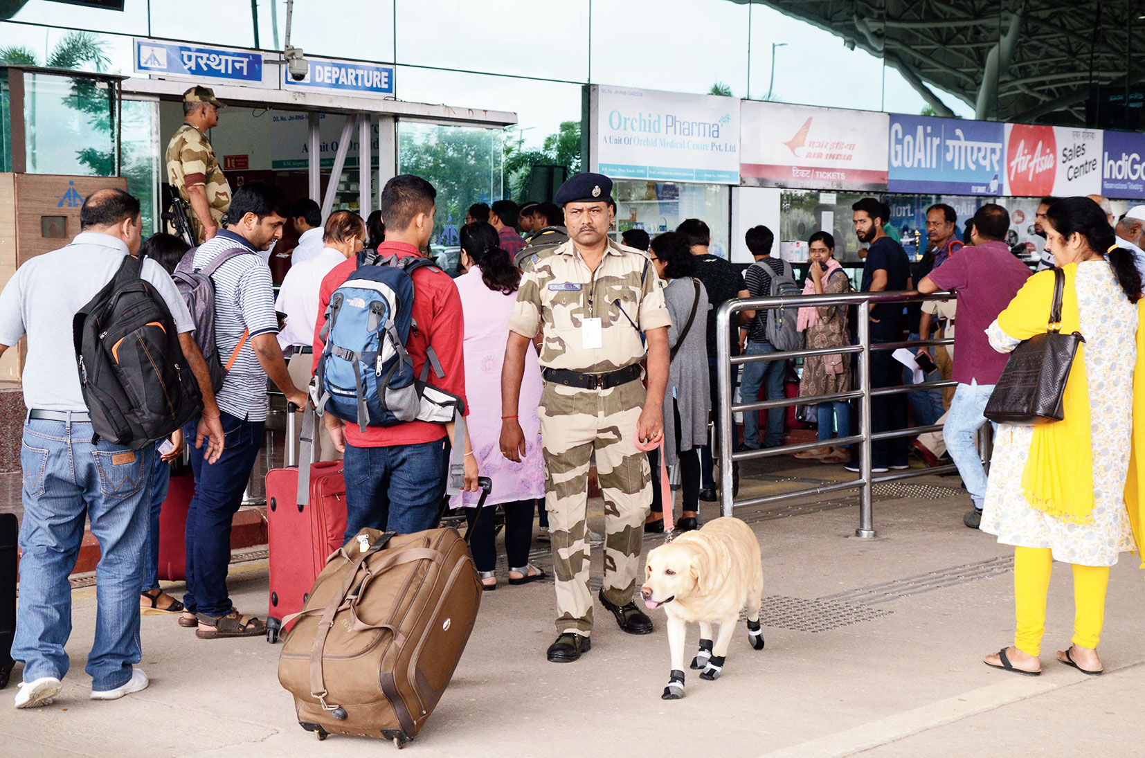A sniffer dog and his handler patrol Birsa Munda Airport in Ranchi on Thursday. 
