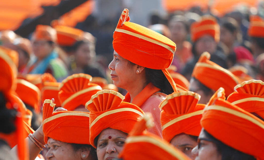 Bharatiya Janata Party's supporters wait for the Indian Prime Minister Narendra Modi's address during a campaign rally ahead of Delhi state elections in New Delhi, on Monday
