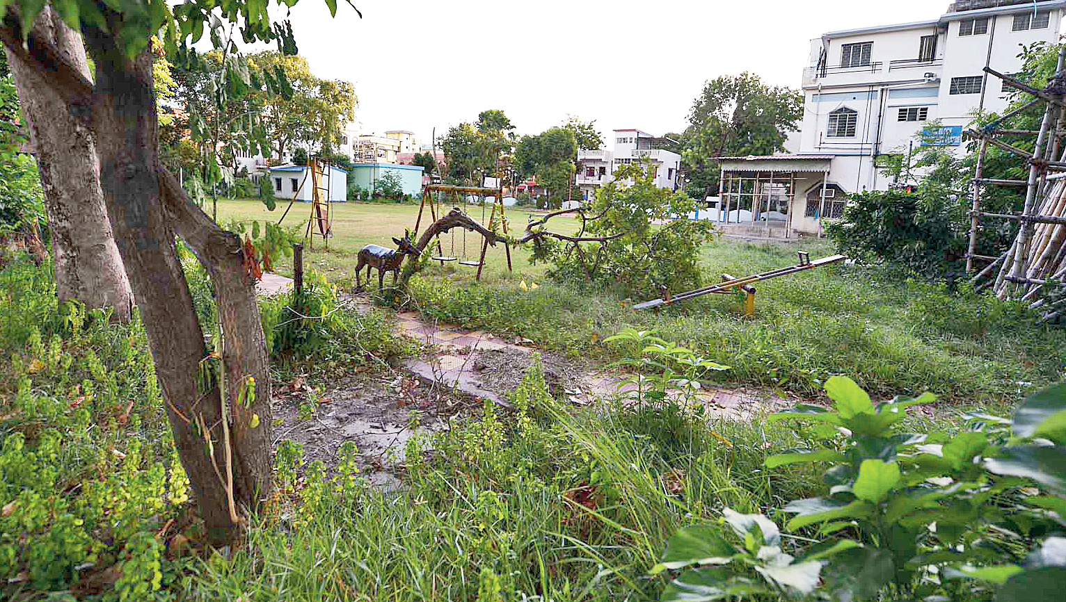 GC Block: Rusty and dilapidated slide, see-saw and swing greet visitors to the park, overrun with tall weeds. Residents said many lights in the park were defunct