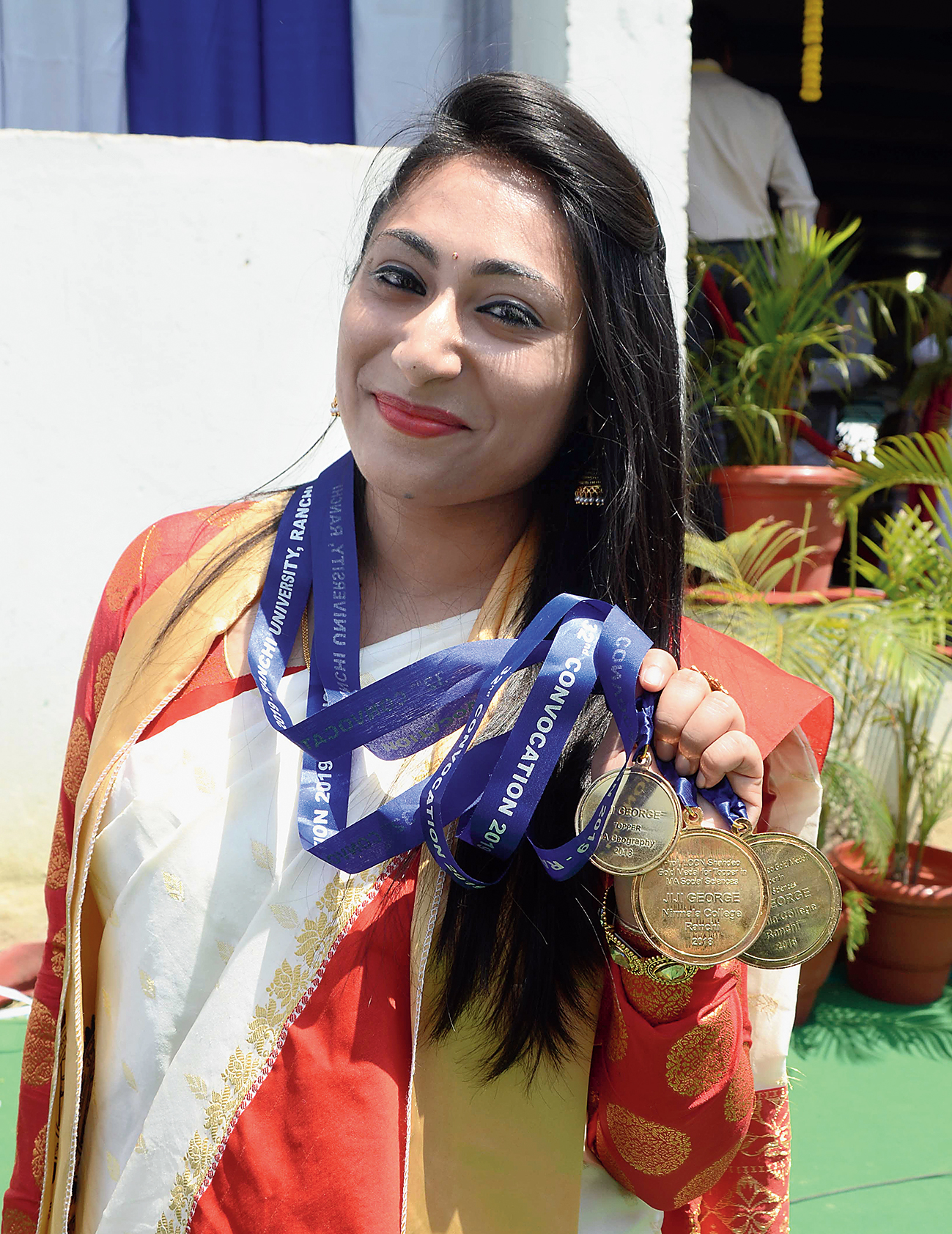 Jiji George flaunts her gold medals.