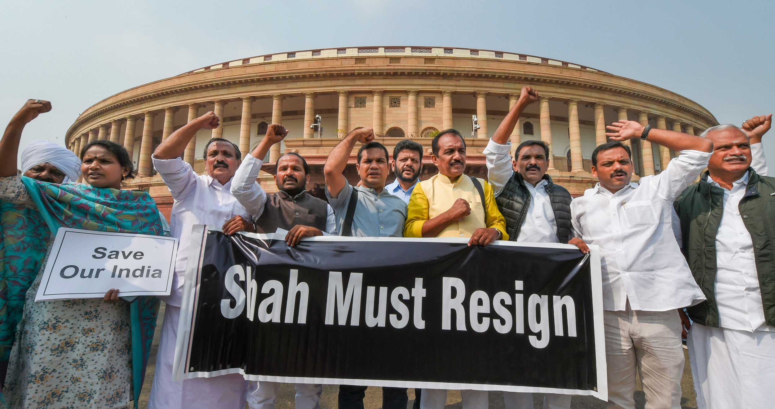 Congress MPs stage a protest against the riots at Parliament during the Budget session in New Delhi on Monday.