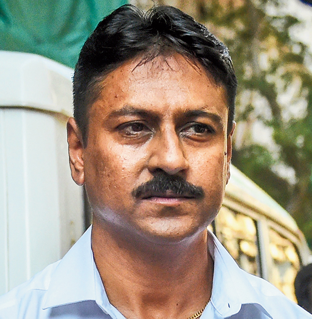 Ashish Pandya, the Gujarat police sub-inspector accused of shooting Tulsiram Prajapati, leaves the special CBI court in Mumbai after his acquittal. 