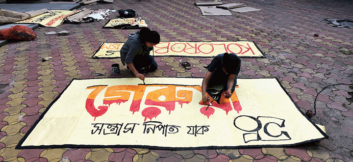 Presidency students paint posters on Wednesday
