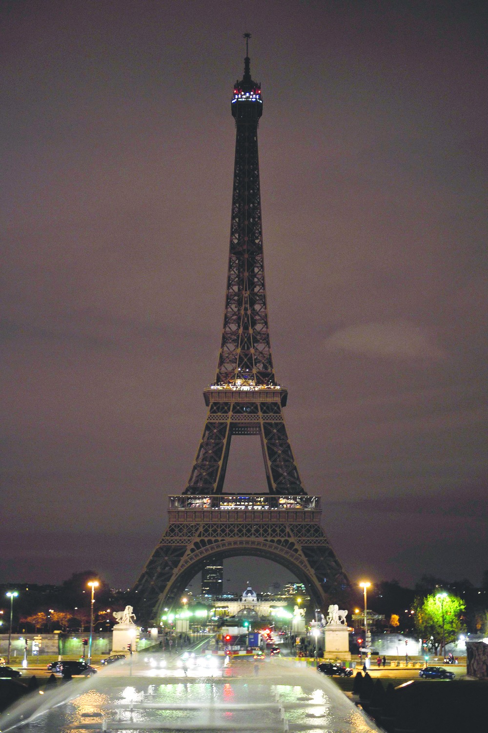 The Eiffel Tower with its lights turned off on Saturday evening following the deadly attacks in Paris.