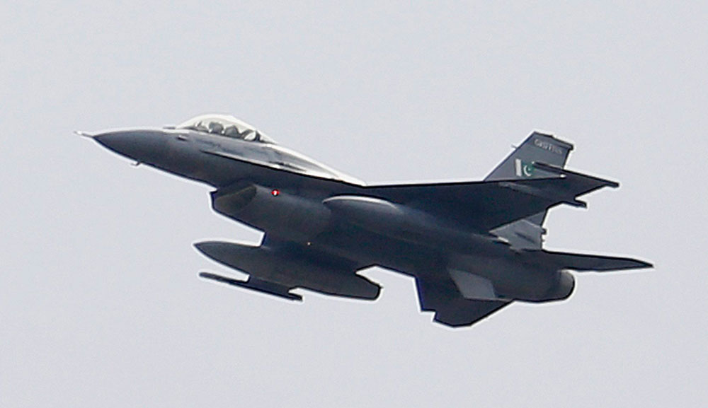 A Pakistani Air Force F-16 fighter jet flies during a military parade 