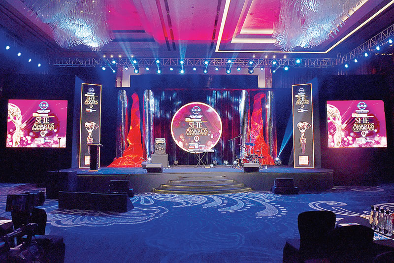 Stage: The stage was adorned with five LCD screens. The backdrop was set off by mirrored strips and two red illuminated installations. “The central LCD was a circular one because it represented the bindi a woman wears,” said Rishabh. “The two red installations were a sort of a geometric representation of a flowing waterbody. The entire piece was wrapped in red thread that is supposed to be auspicious. The wrapping took about a week to do,” said Swarup. “The red flowing waterbody installation represented the flowing emotions of a woman and there was a lot of trial and error involved when making it,” said Baisakhi.