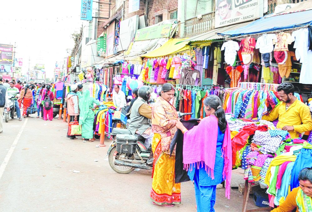 
Hawkers sell their wares along the busy Main Road in Ranchi on Monday.