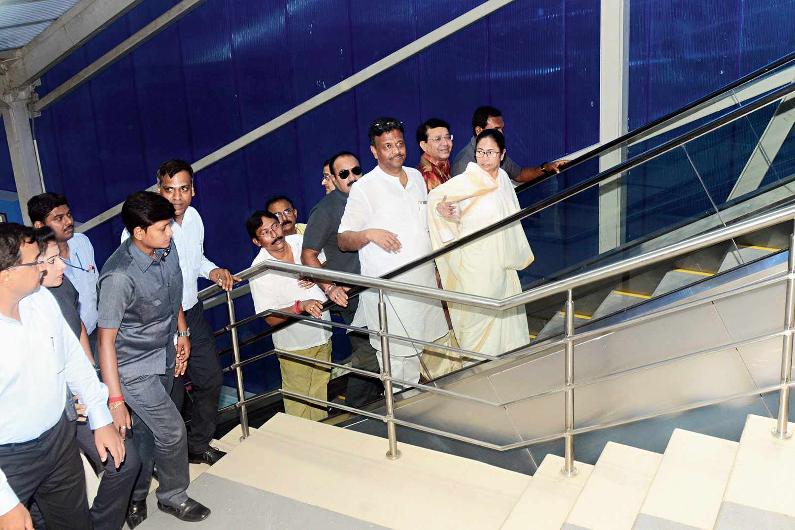 Mamata with urban development minister Firhad Hakim take an escalator to reach the skywalk.