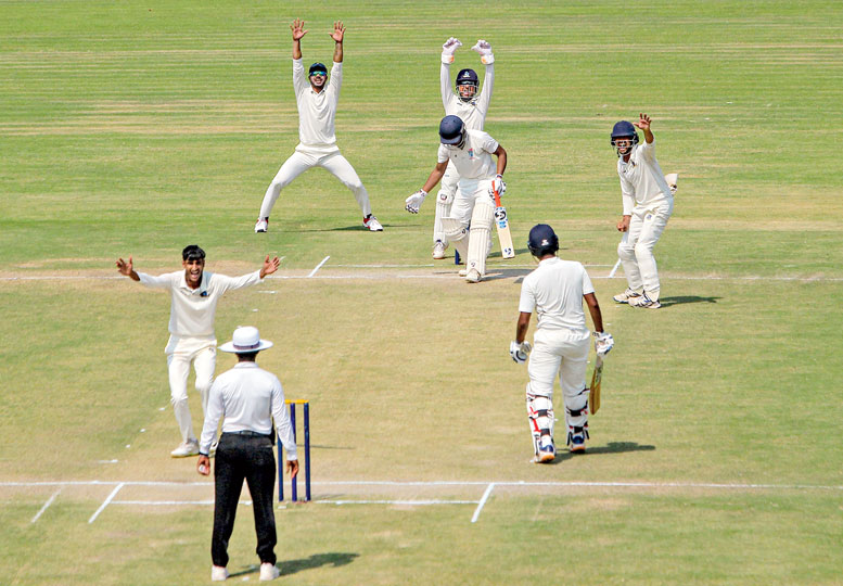 Bengal players appeal for a leg before decision against Odisha’s Shantanu Mishra during the Ranji Trophy quarter-final clash in Cuttack on Friday